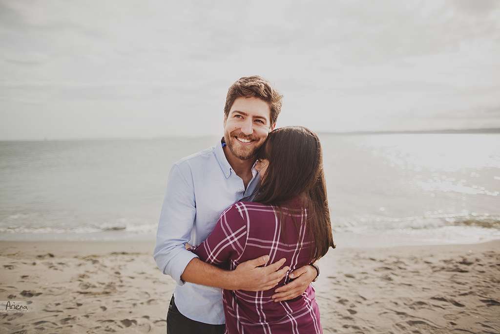 Engagement session at Discovery Park, Seattle. Beautiful lighthouse on background