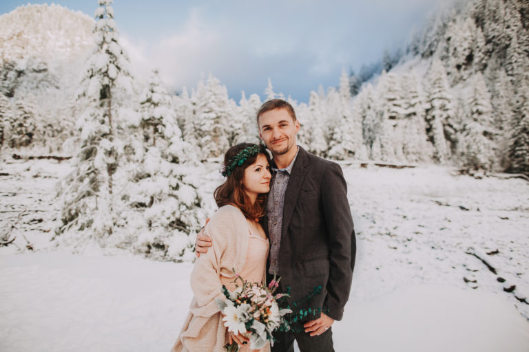 Elopement at Mount Rainier in winter at sunset time. Golden hours and snow in Rocky Mountains